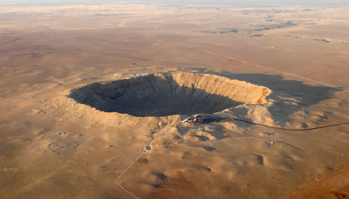 Aerial view of Meteor Crater in Arizona, a stark reminder of the biggest asteroid impacts on Earth